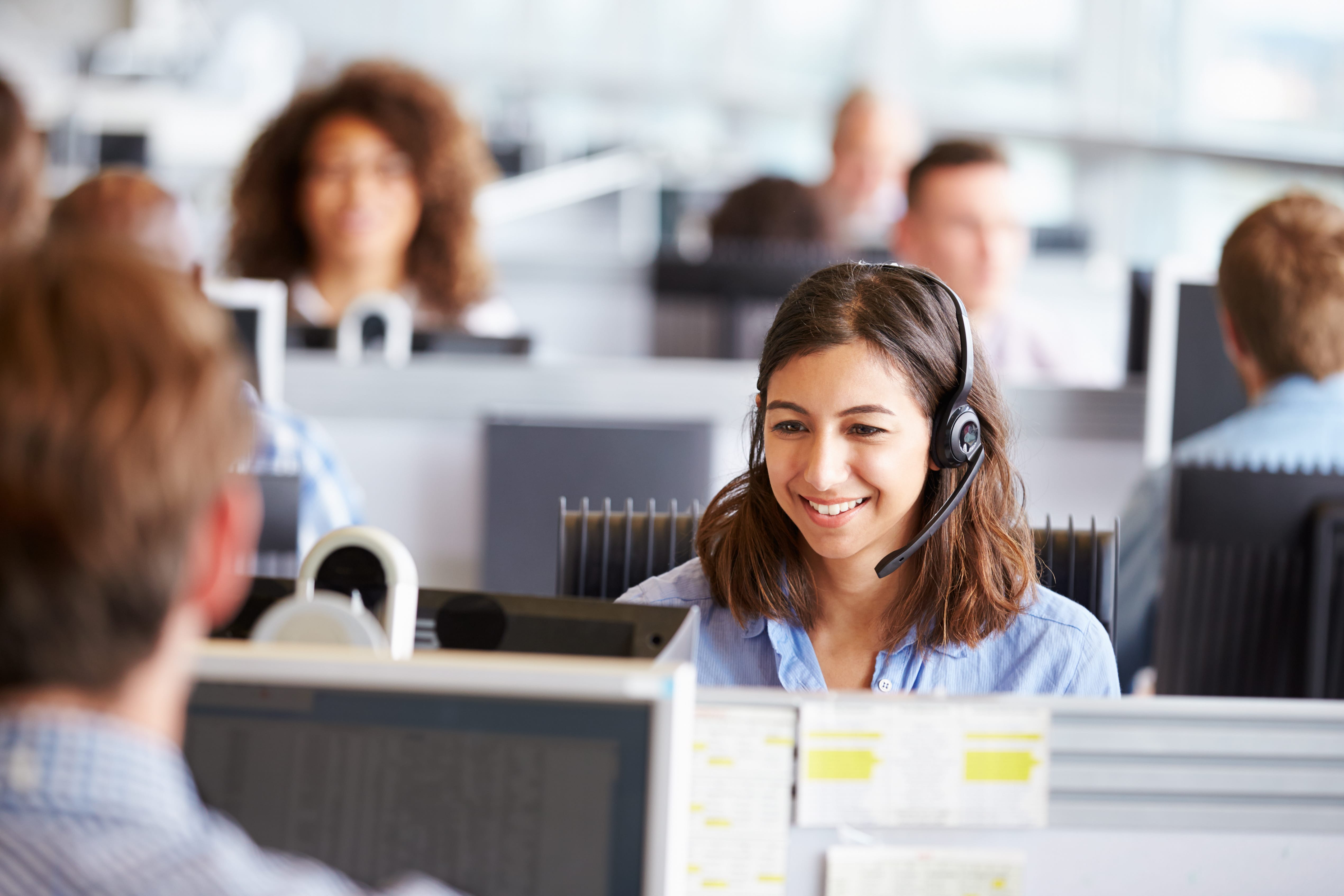 female with headset on working in call centre