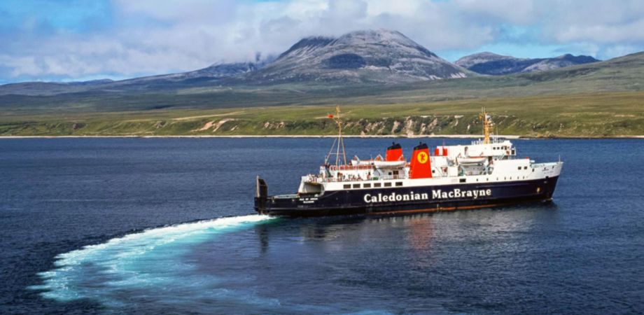 A photo of cars on a Caledonian MacBrayne ferry deck with the Shetland countryside in the background