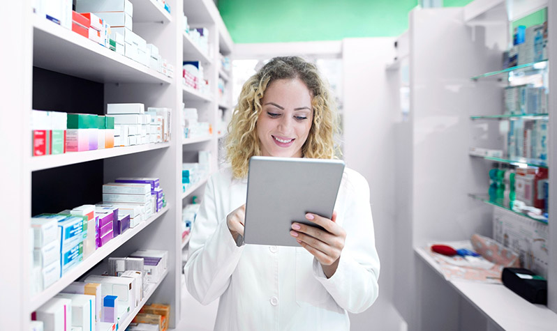 Pharmacist at work using a tablet