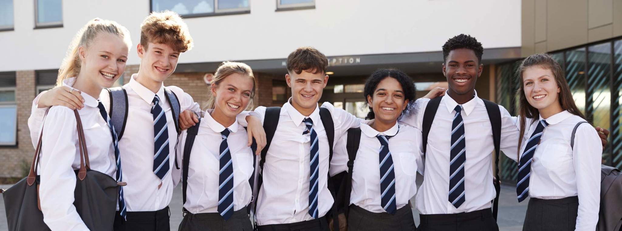 An image of school children grouped together wearing uniform