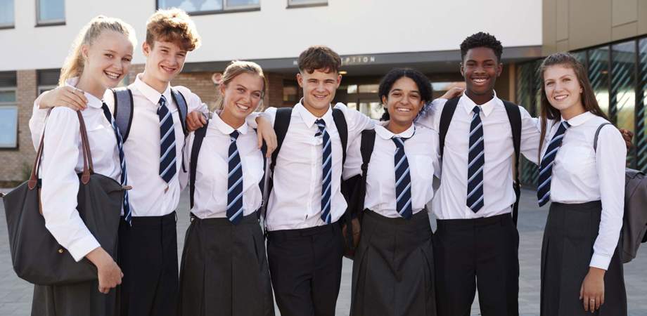 An image of school children grouped together wearing uniform