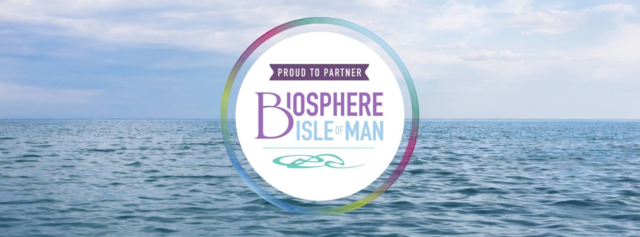 Biosphere Isle of Man logo over background of the sea