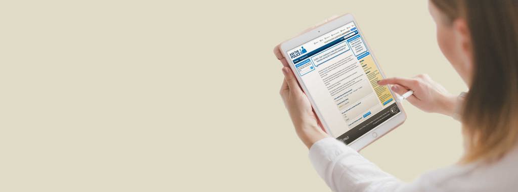 Lady holding an iPad with the PNLD site displaying