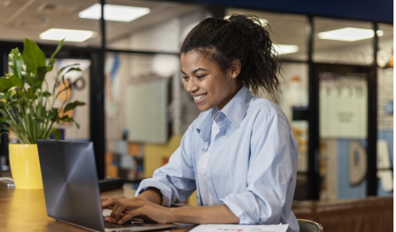 Lady On Laptop Smiling