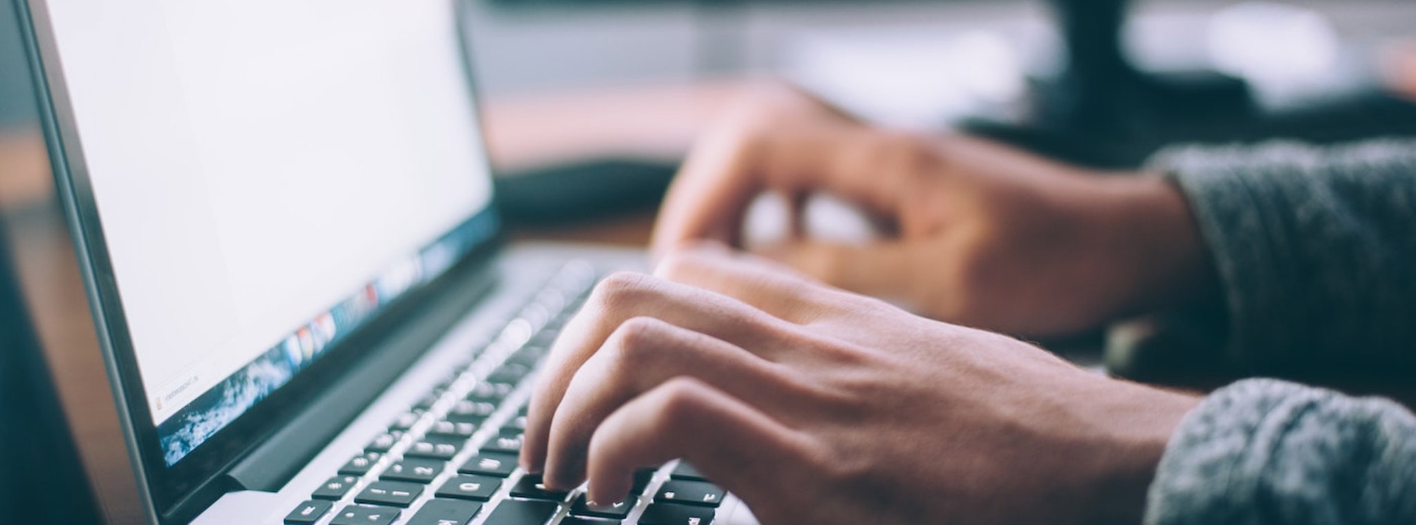 A photo of somebody using a laptop