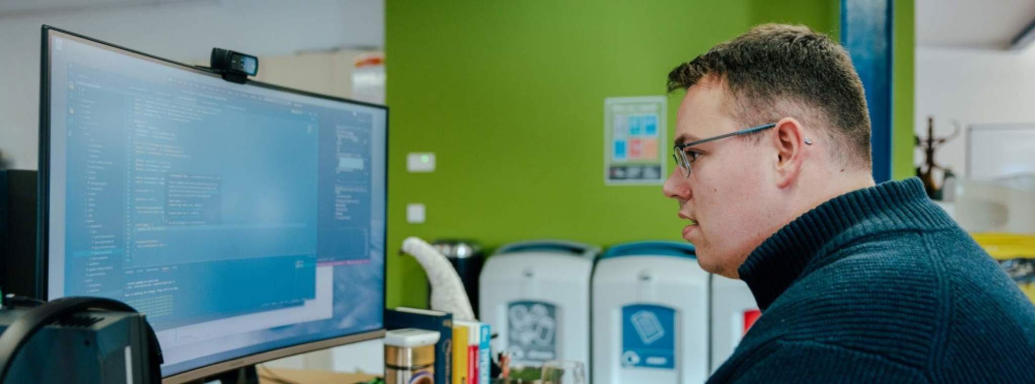 Photo of Senior Front-End Developer Nick Collins doing coding on a computer screen