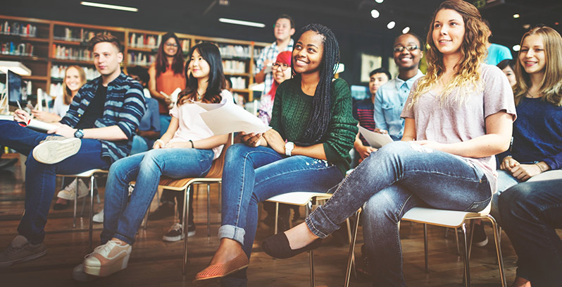 Several students sitting in a classroom