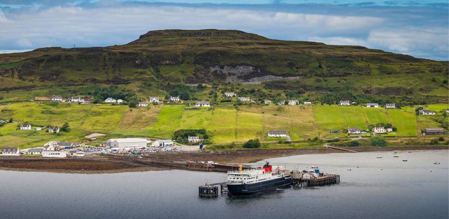 A panoramic photo of a ferry docked in the Shetland Islands