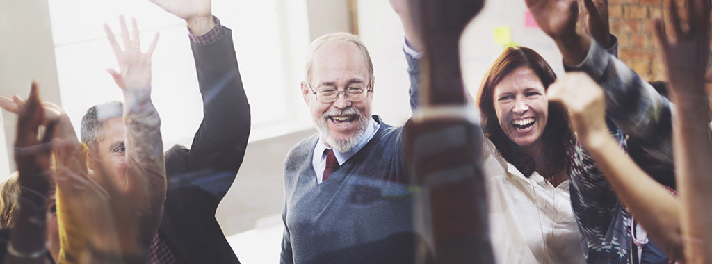 Diverse group of people , smiling with arms out stretched