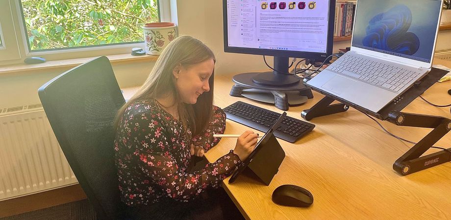 A photo of work experience student Zoe Durcan working at her desk