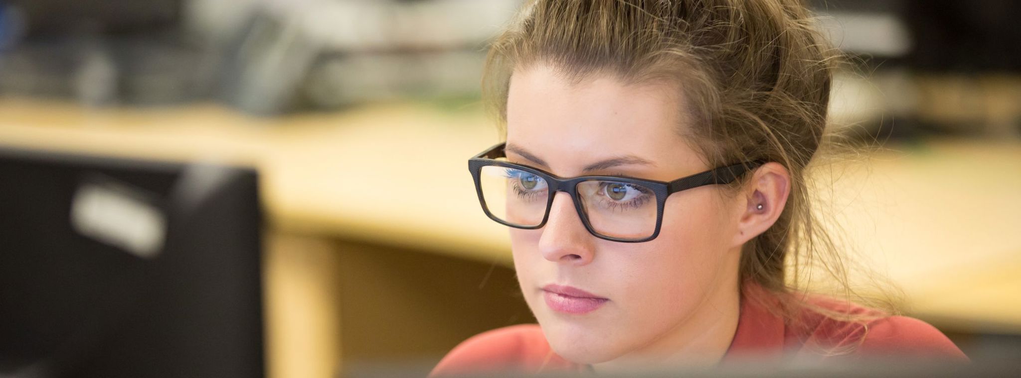 Hannah Phillips working at her computer