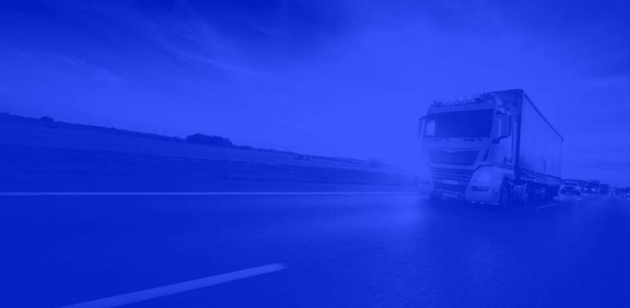 An image of a lorry being driven down a motorway with blue overlay