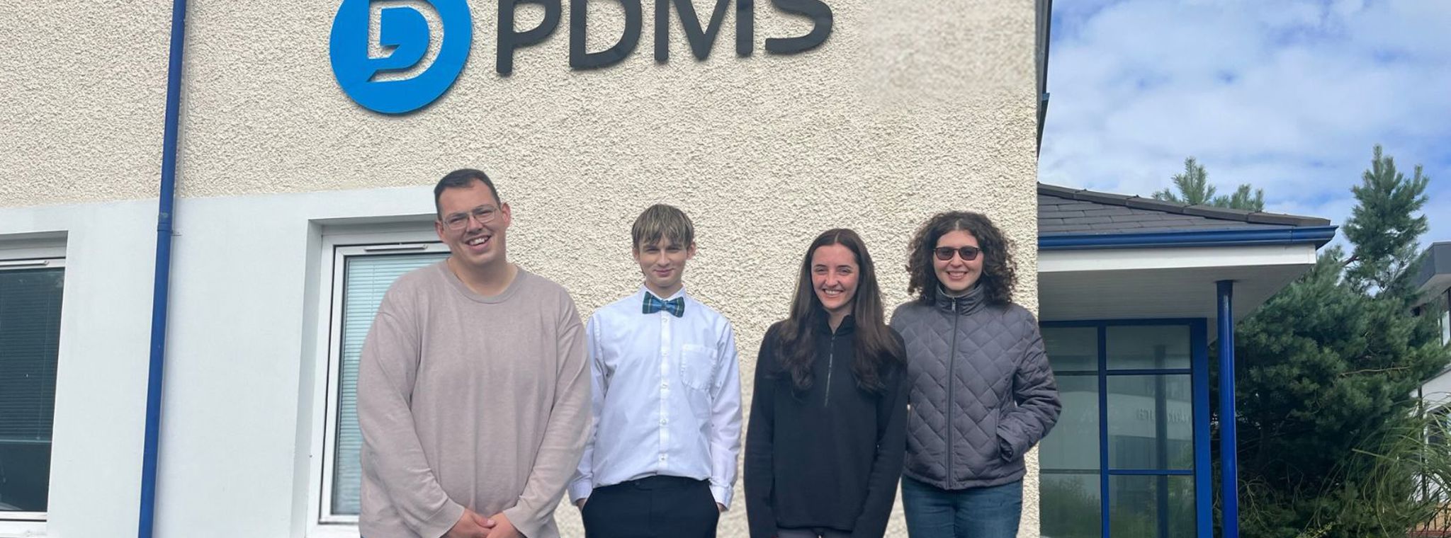 Four people stood outside PDMS Global House - L:R Nick Collins, Dagan Harris, Georgia Vernon, Alexandra Koyfman