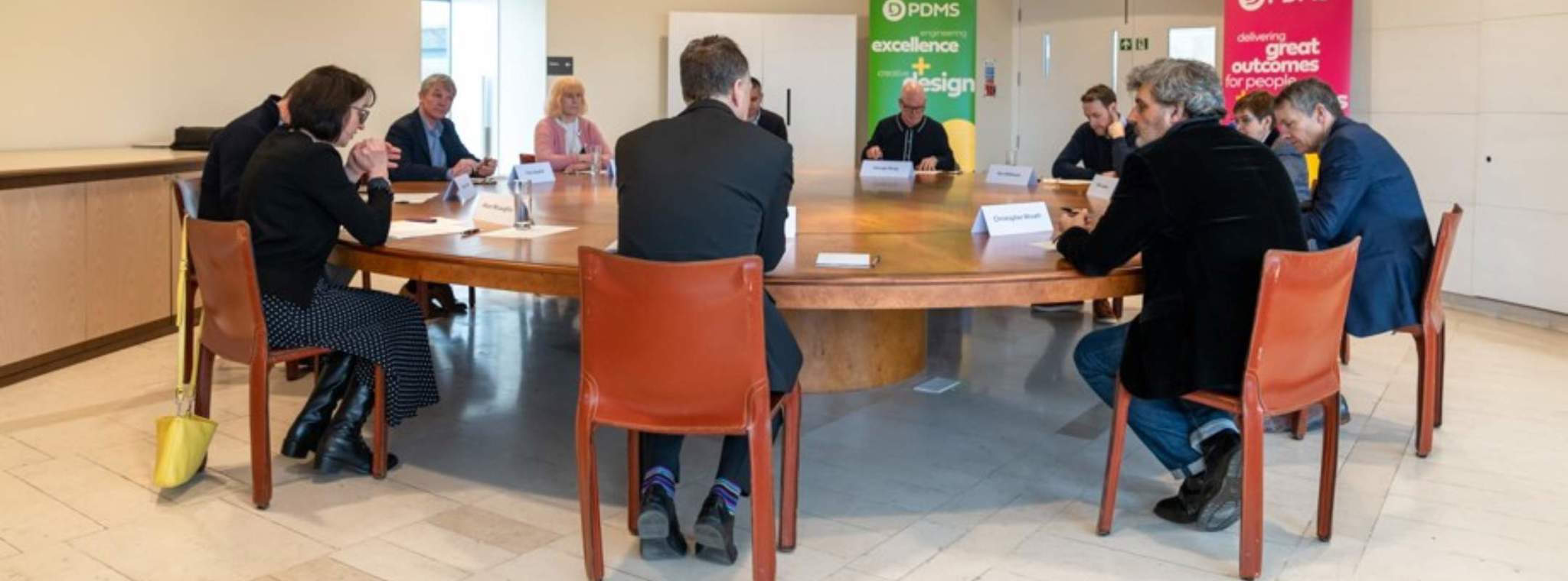 Roundtable participants sat around table having a discussion