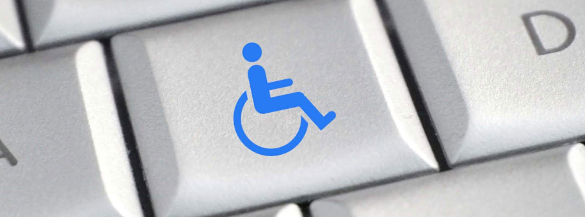 Disability icon in blue on a computer keyboard