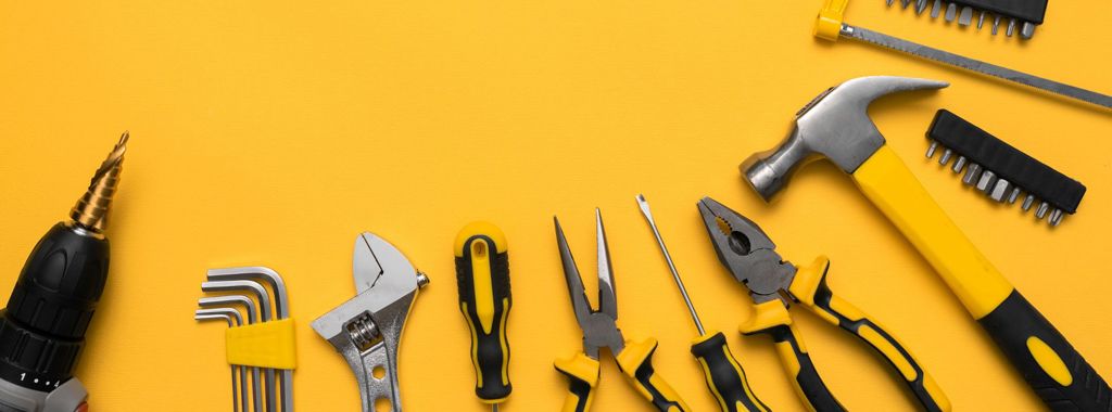 Various tools on a yellow background