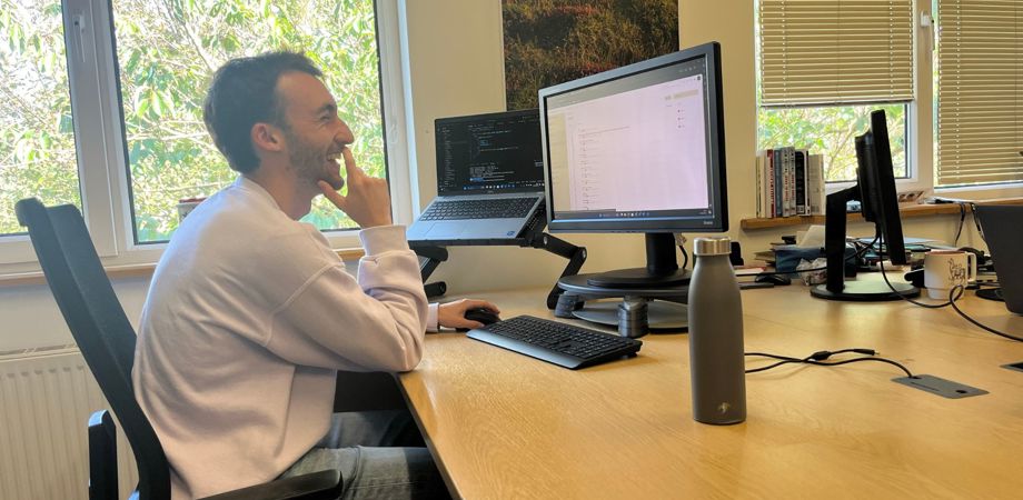 Student Dominic Hubble sat at a desk using the computer